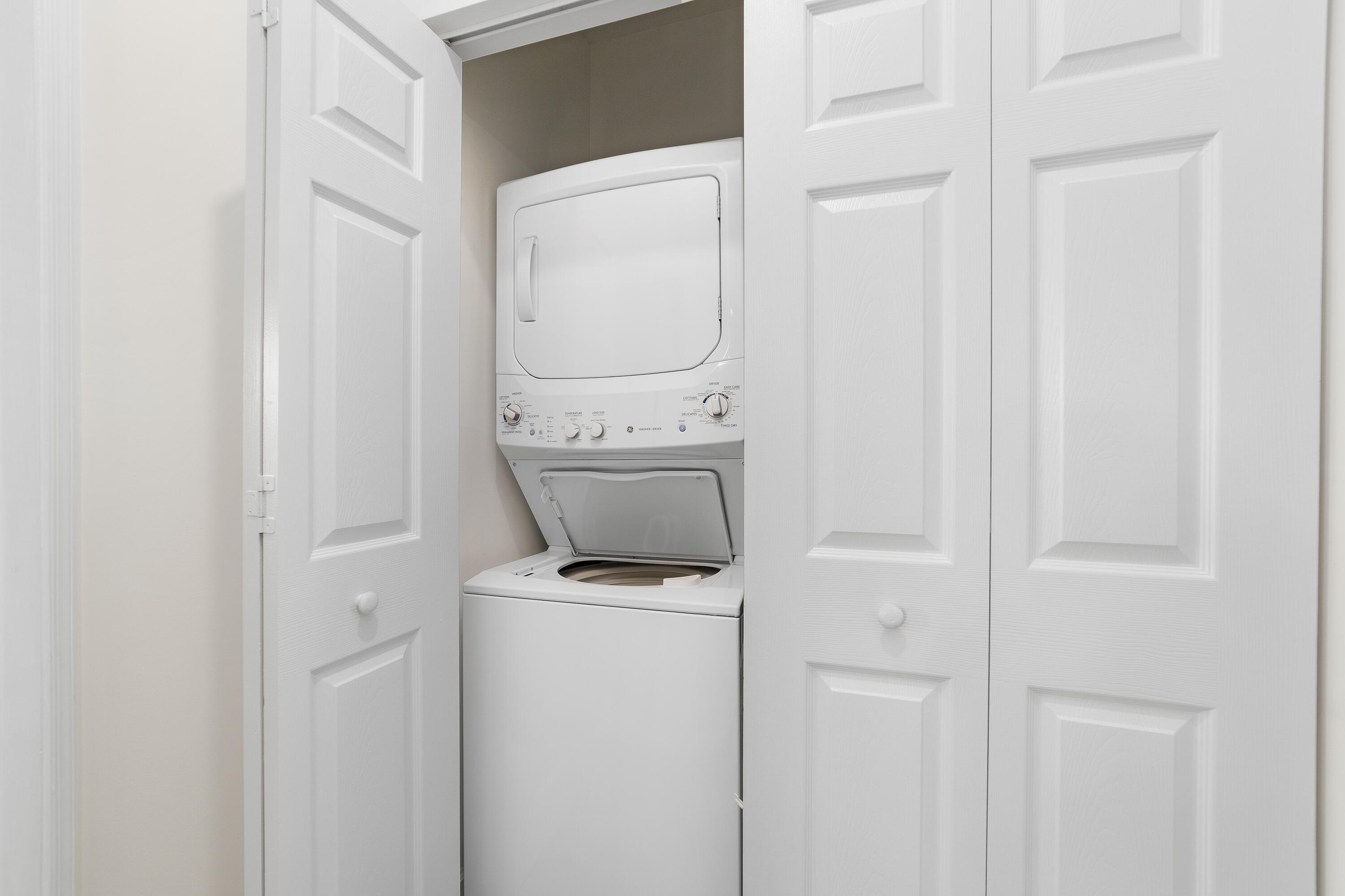 6121 Southeast Landing Way, Unit 12 Stuart, FL 34997 - Photo 31 of 47 a utility room with dryer and washer