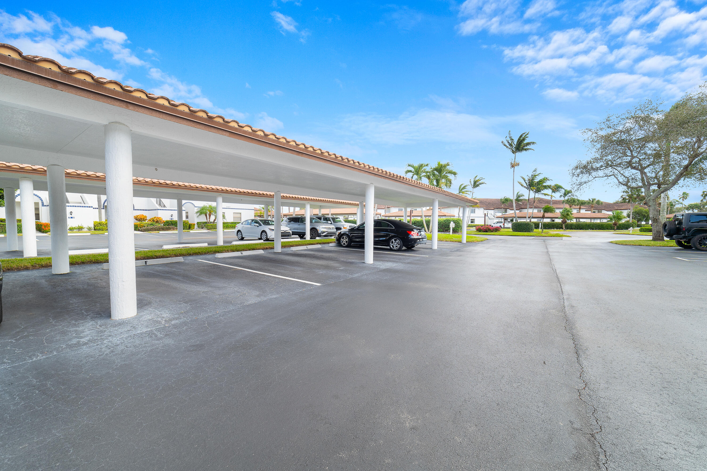 6121 Southeast Landing Way, Unit 12 Stuart, FL 34997 - Photo 34 of 47 a view of a street with cars