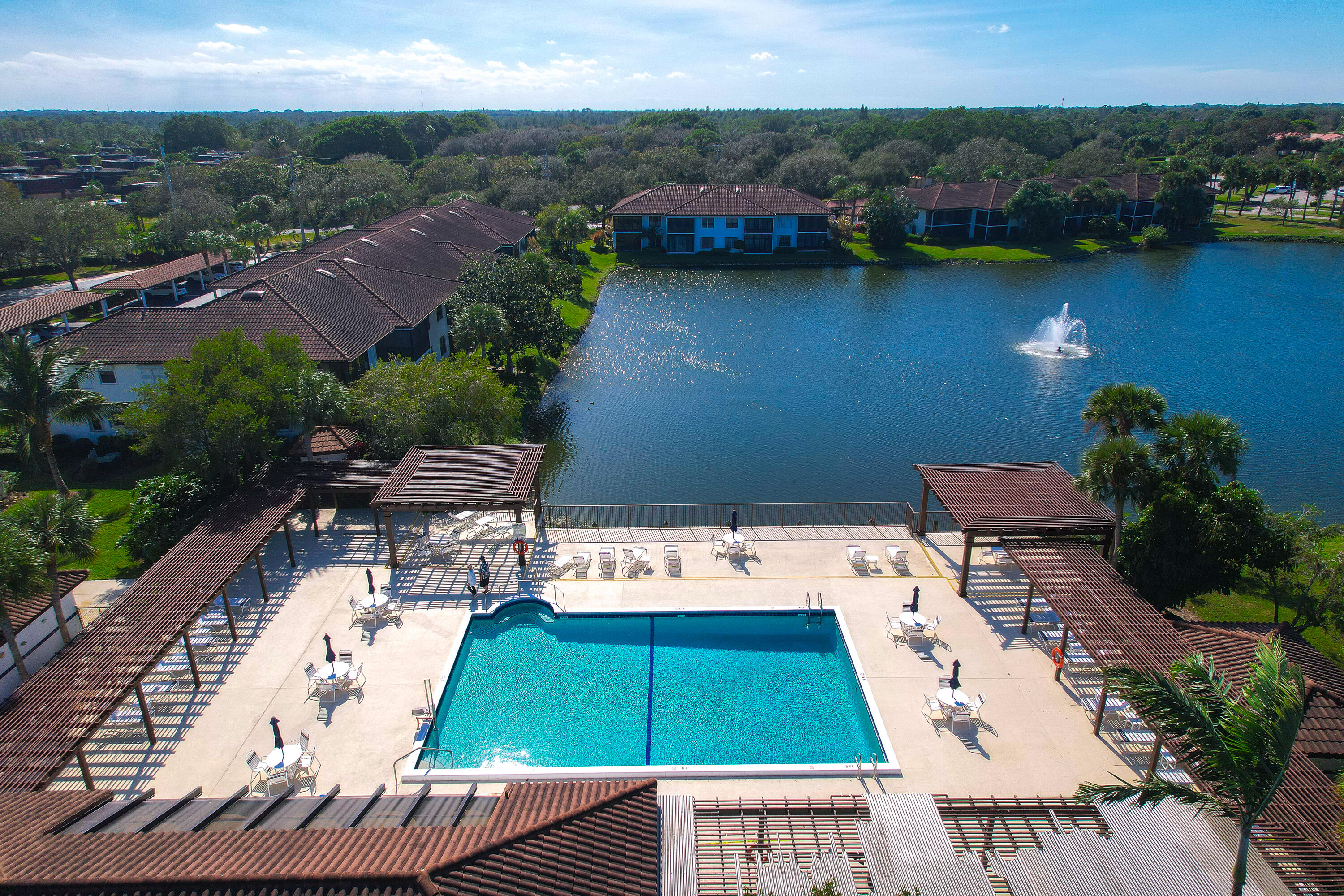 6121 Southeast Landing Way, Unit 12 Stuart, FL 34997 - Photo 35 of 47 an aerial view of a house with a lake view