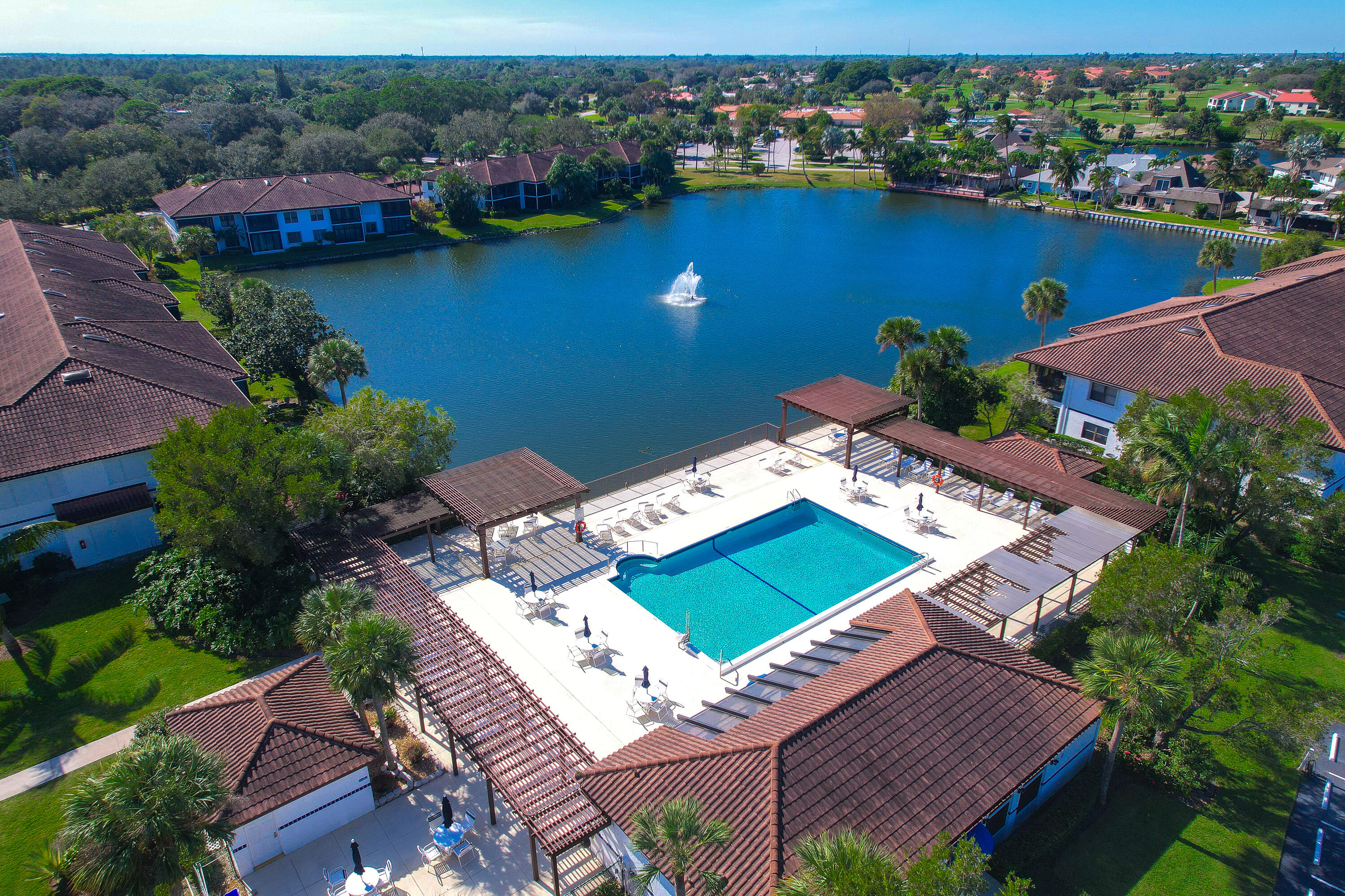 6121 Southeast Landing Way, Unit 12 Stuart, FL 34997 - Photo 36 of 47 an aerial view of a house with a lake view