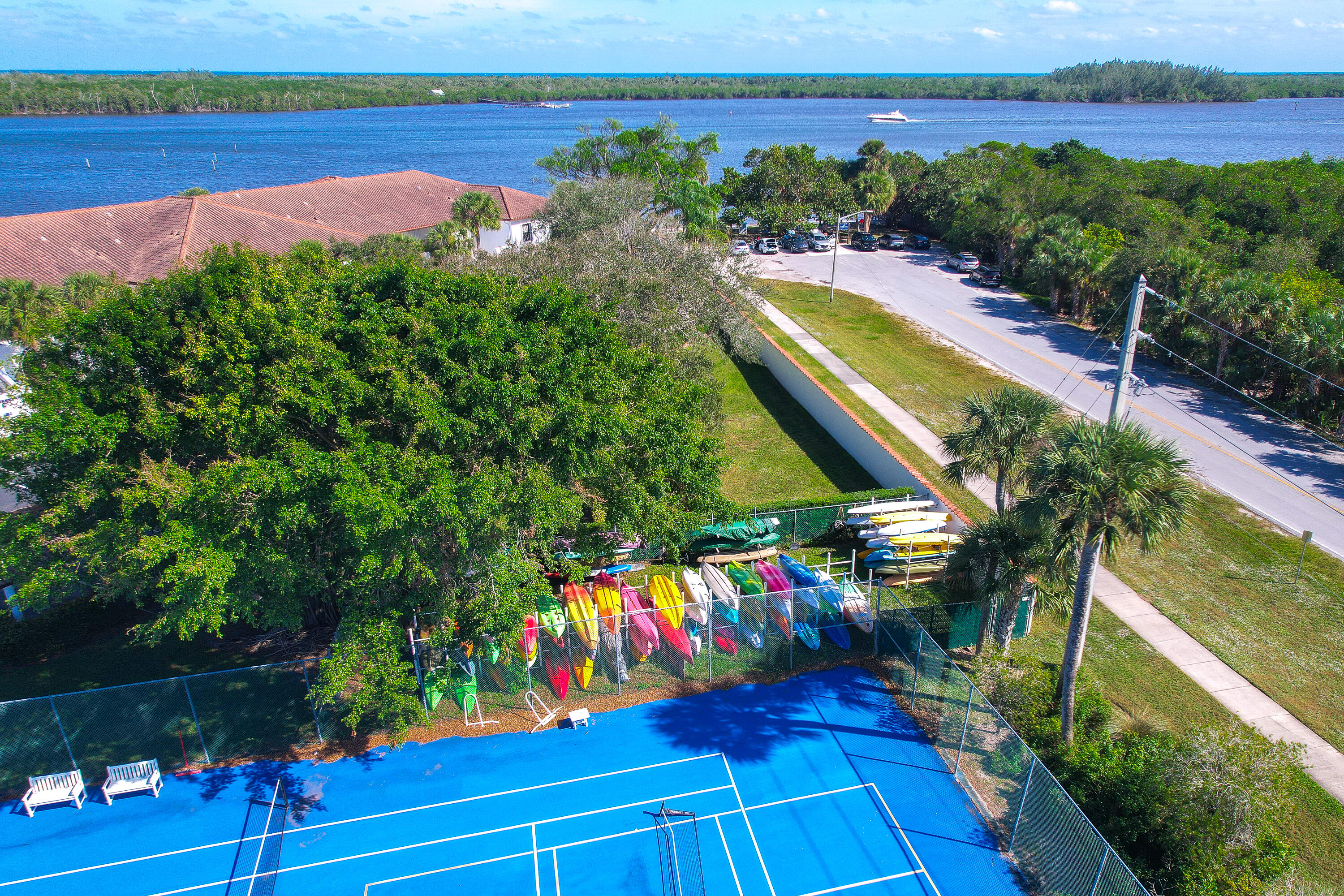 6121 Southeast Landing Way, Unit 12 Stuart, FL 34997 - Photo 40 of 47 an aerial view of a house with a garden and swimming pool