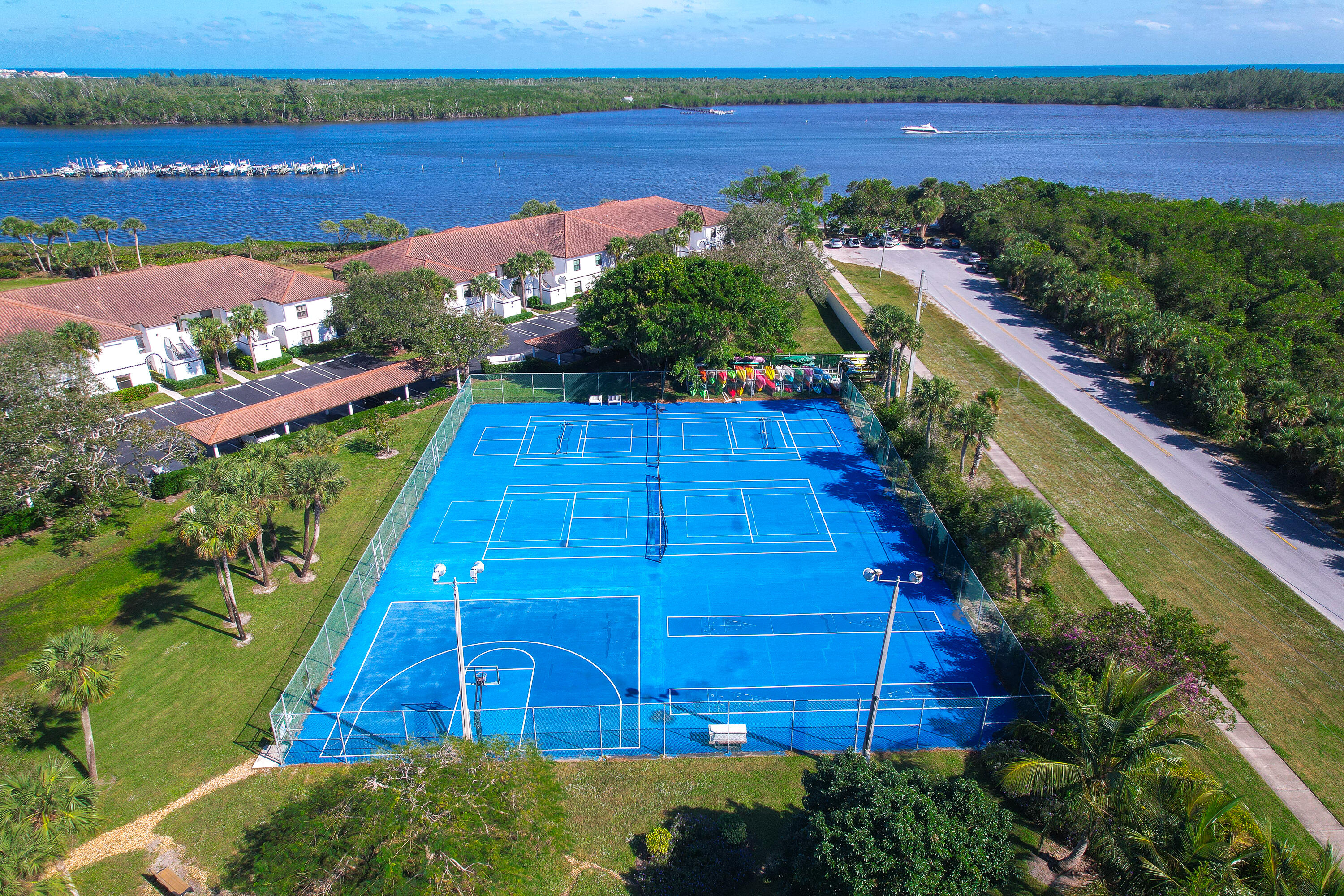 6121 Southeast Landing Way, Unit 12 Stuart, FL 34997 - Photo 41 of 47 a view of a tennis court
