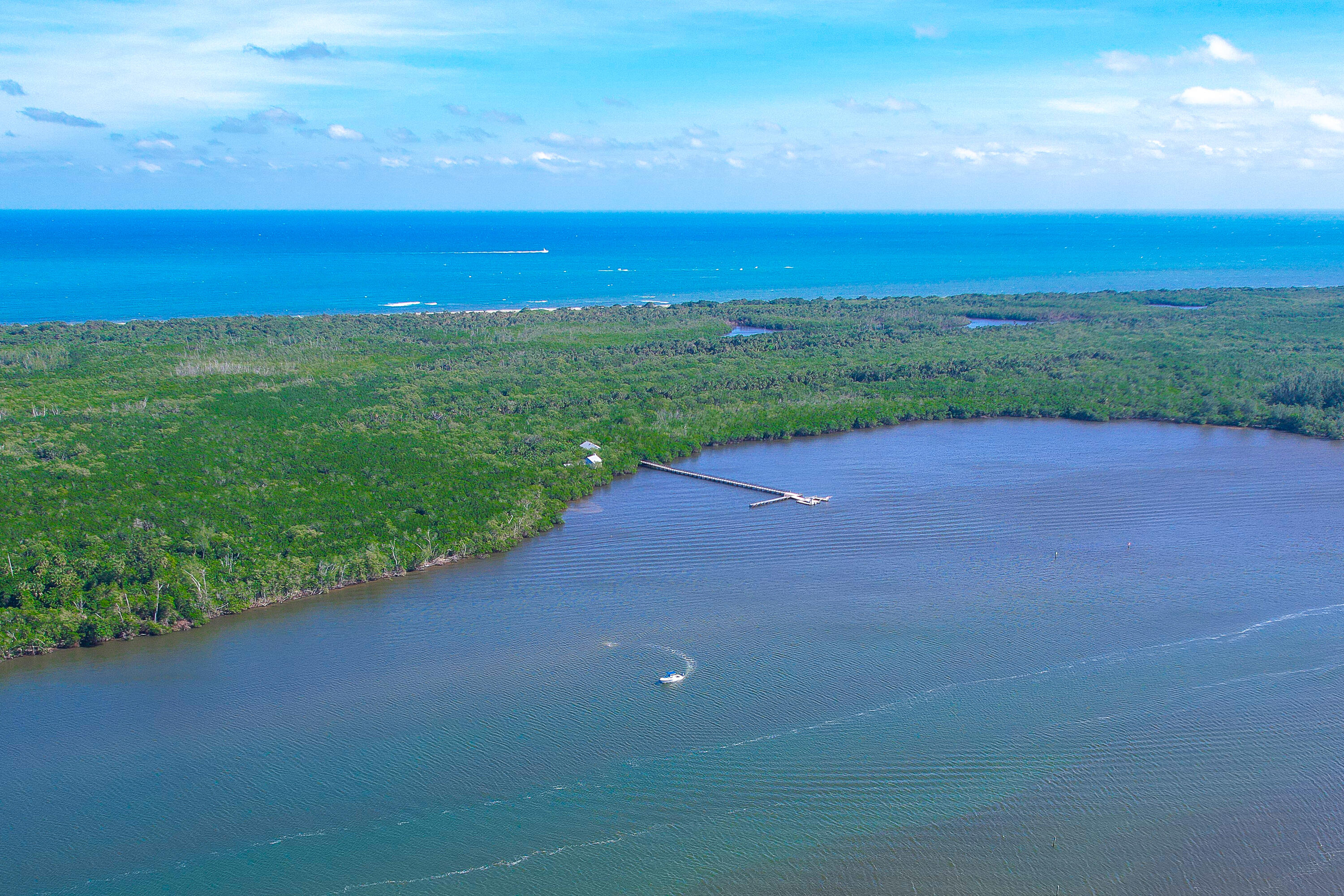 6121 Southeast Landing Way, Unit 12 Stuart, FL 34997 - Photo 45 of 47 a view of a beach with a big yard