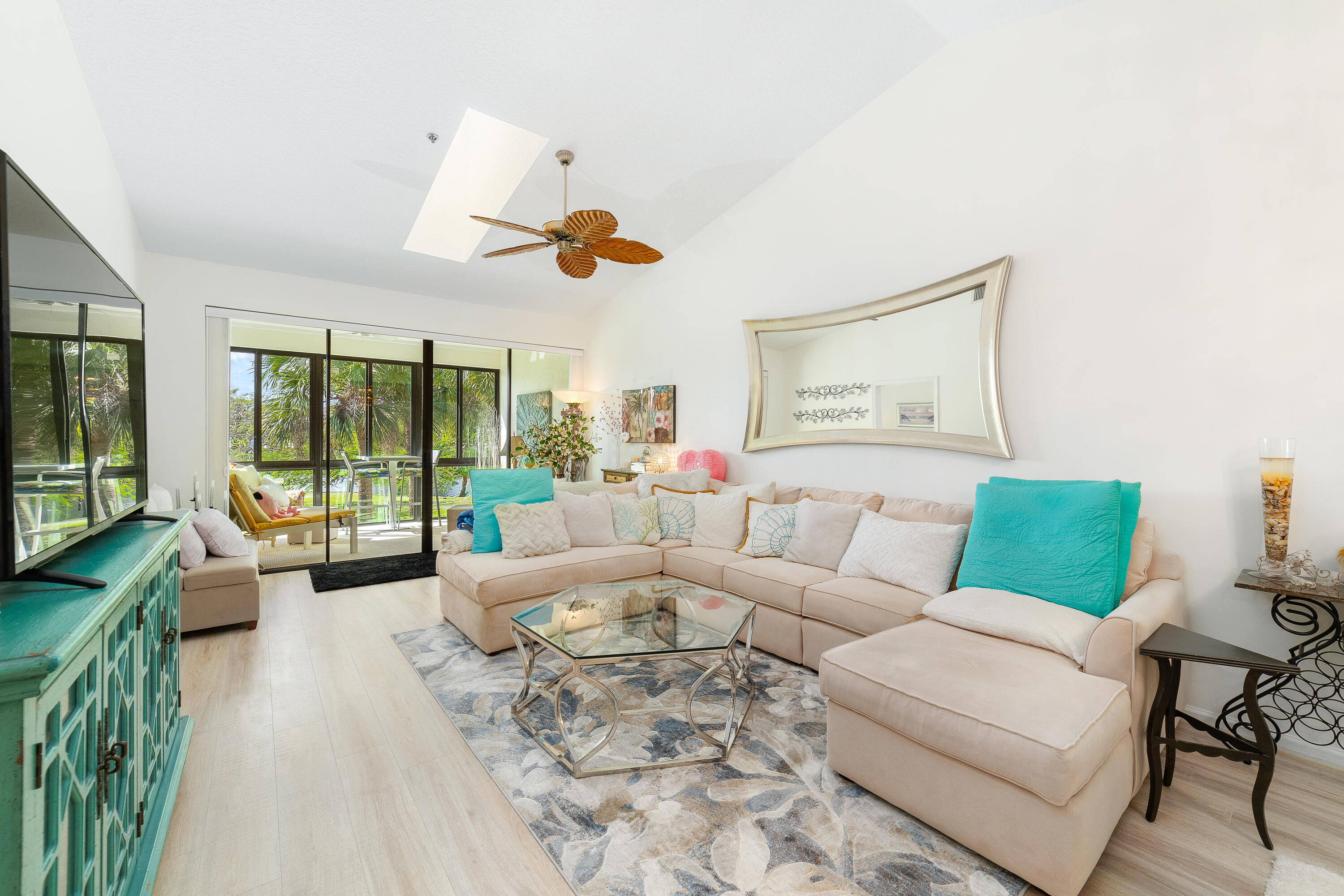 6121 Southeast Landing Way, Unit 12 Stuart, FL 34997 - Photo 5 of 47 a living room with furniture and a large window