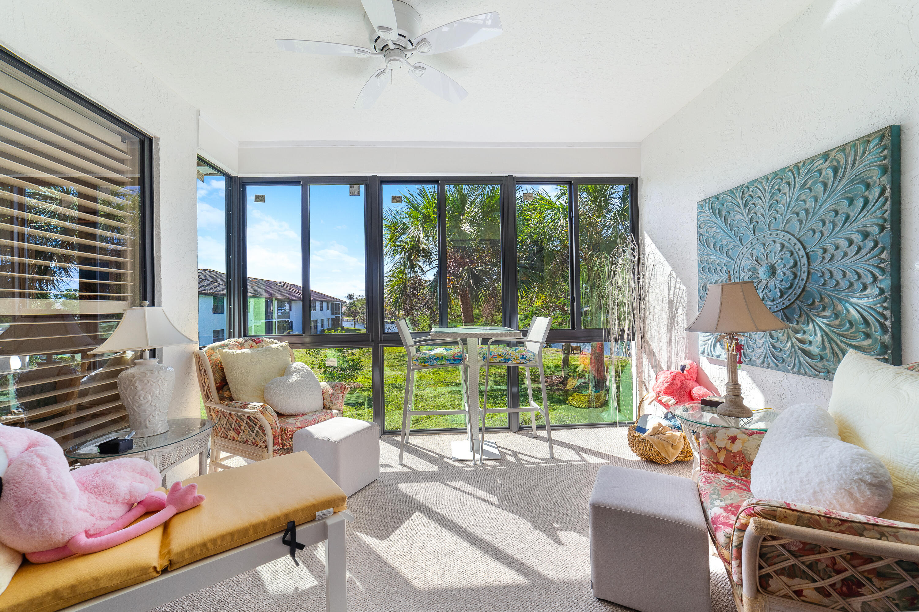 6121 Southeast Landing Way, Unit 12 Stuart, FL 34997 - Photo 9 of 47 a living room with furniture and a large window