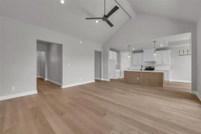 a view of a kitchen with a sink and cabinets
