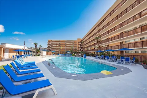 a view of a swimming pool from a balcony