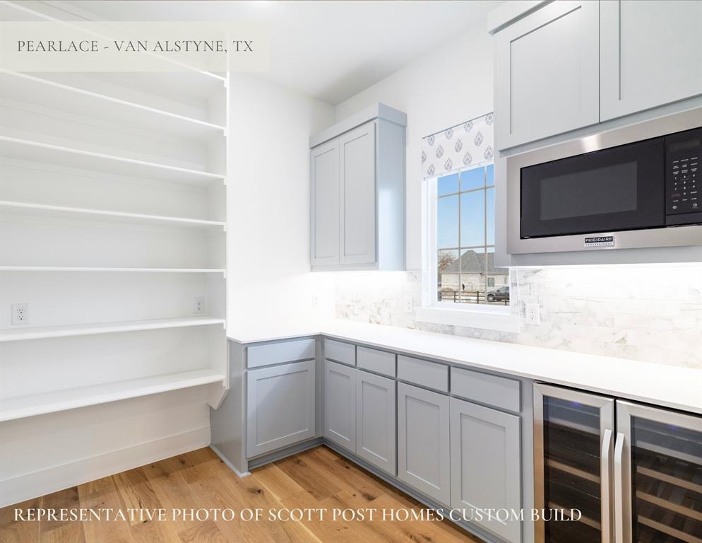 Tbd Lot 9 Tbd Van Alstyne, TX 75495 - Photo 12 of 19 a kitchen with a sink cabinets and a microwave