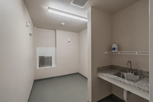 a bathroom with a sink and a window