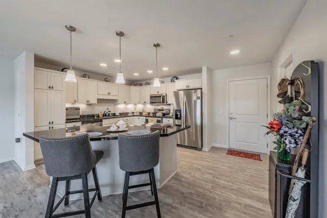 a spacious bedroom with a bed and window