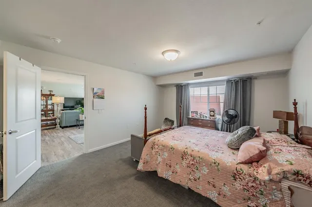 a bathroom with a double vanity sink mirror and toilet