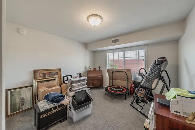 a bathroom with a double vanity sink mirror and toilet