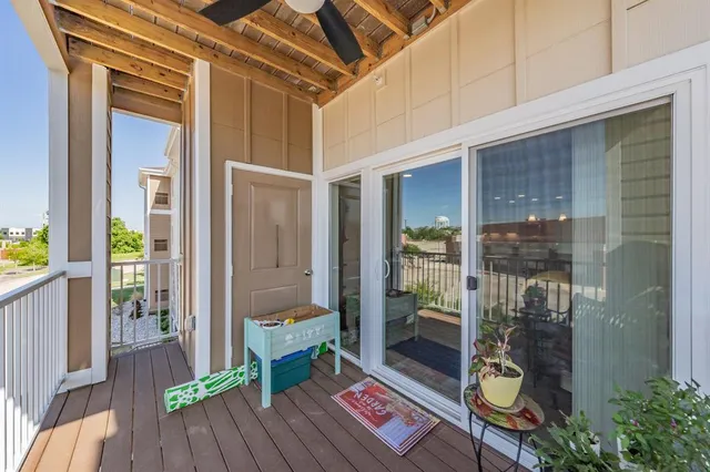 a view of balcony with wooden floor