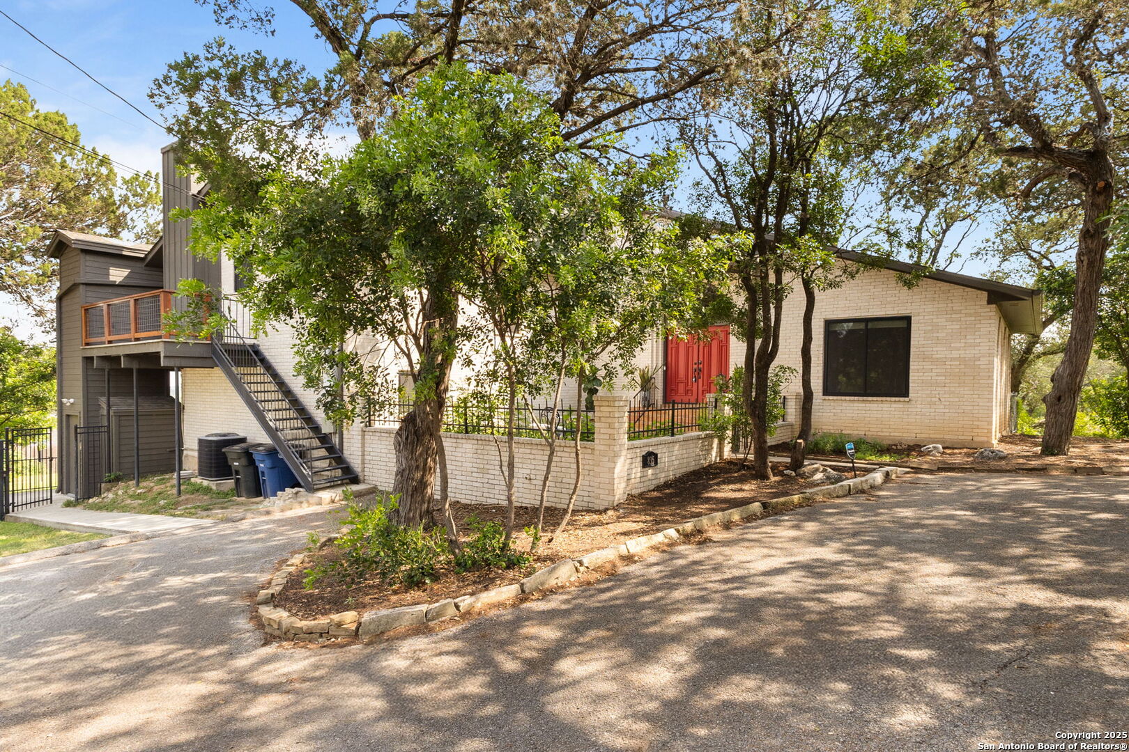 835 Fredericksburg Road New Braunfels, TX 78130 - Photo 3 of 56 a front view of a house with a yard and garage