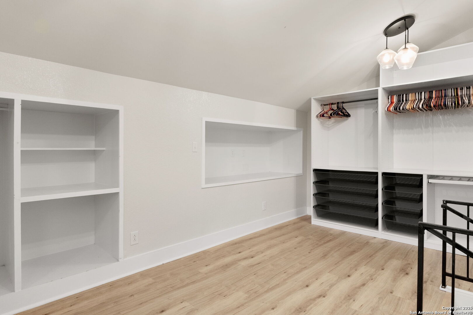 835 Fredericksburg Road New Braunfels, TX 78130 - Photo 31 of 56 a view of an empty room with wooden floor and closet
