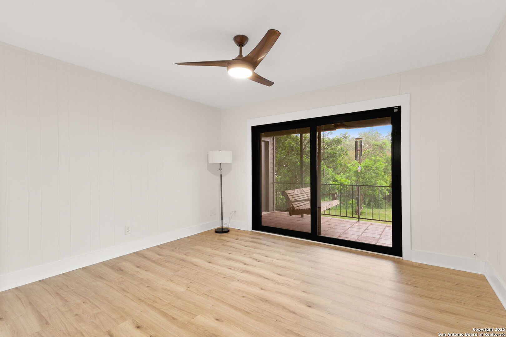 835 Fredericksburg Road New Braunfels, TX 78130 - Photo 38 of 56 an empty room with wooden floor and windows