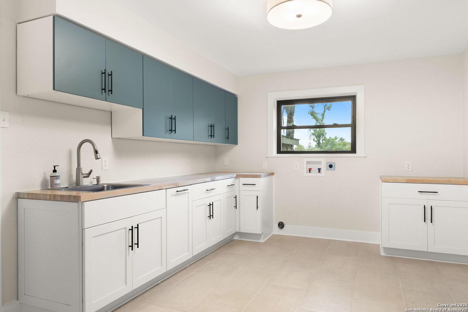 835 Fredericksburg Road New Braunfels, TX 78130 - Photo 39 of 56 a kitchen with sink and cabinets