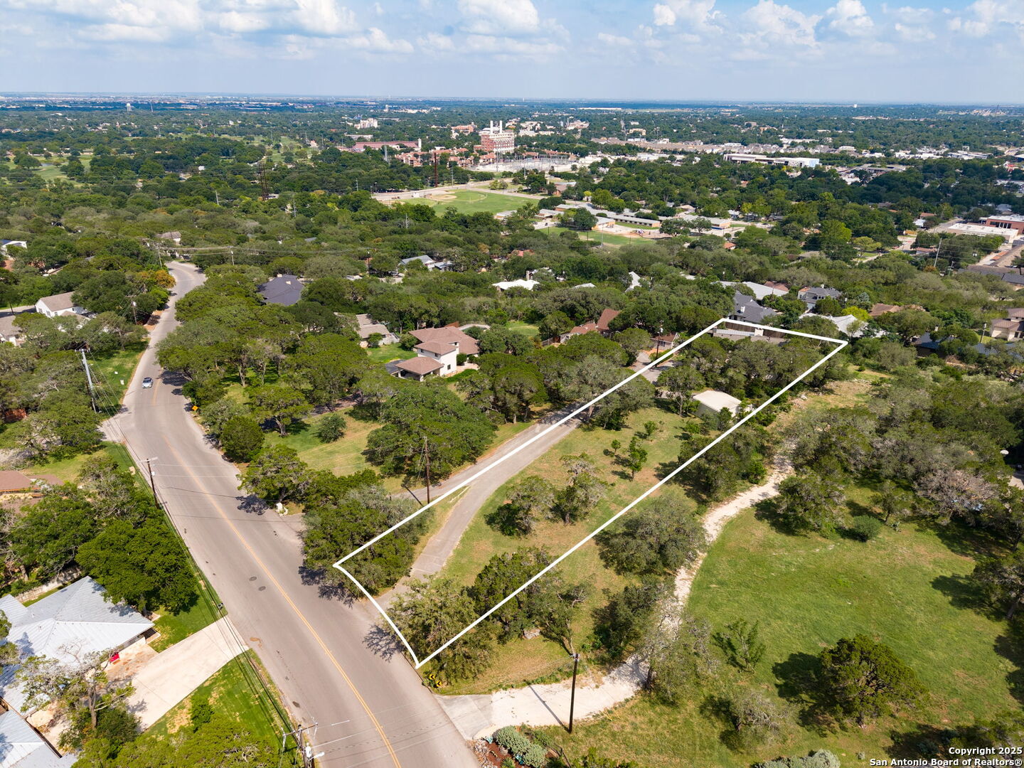 835 Fredericksburg Road New Braunfels, TX 78130 - Photo 53 of 56 an aerial view of residential houses with outdoor space and trees