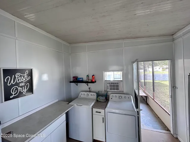 a view of storage and utility room with washer and dryer