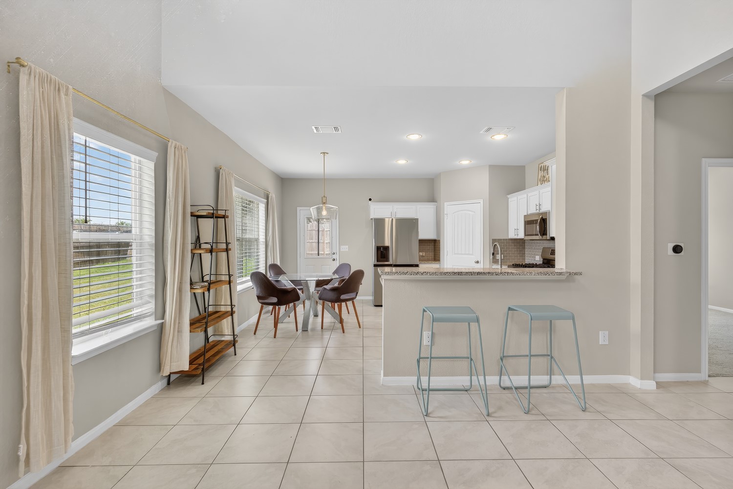 2006 Grow Lane Austin, TX 78754 - Photo 6 of 40 An open-concept living space integrates a well-appointed kitchen with an informal dining area.