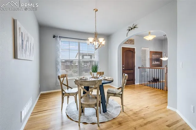 a view of a dining room with furniture window and wooden floor