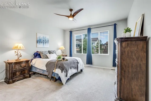 a bed room with a bed and a window