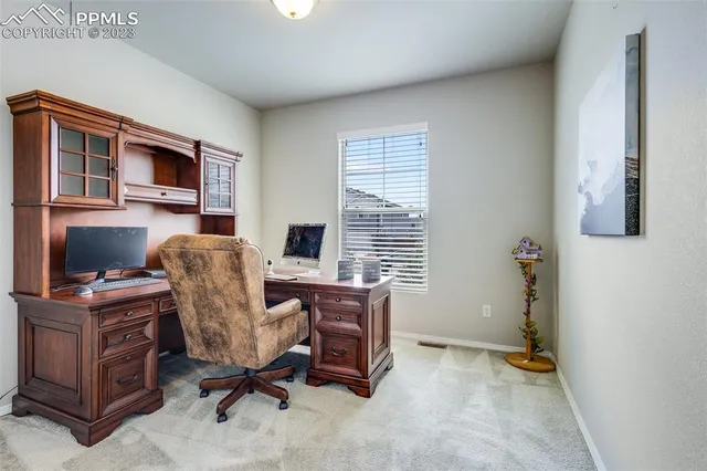 a view of a workspace with furniture