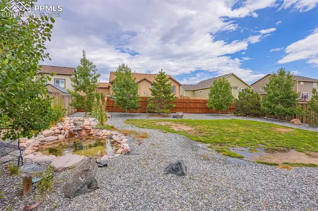 a view of a playground with basketball court