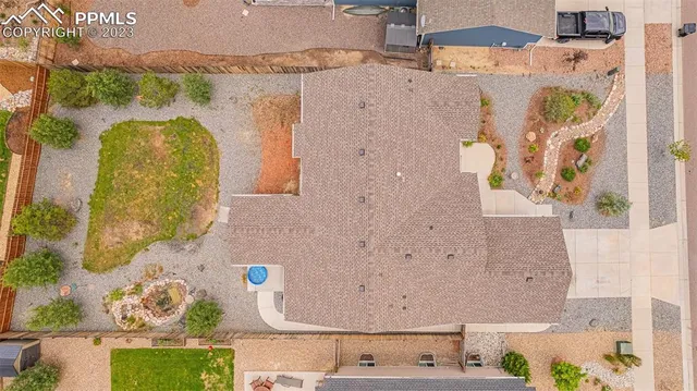 an aerial view of a house with a swimming pool