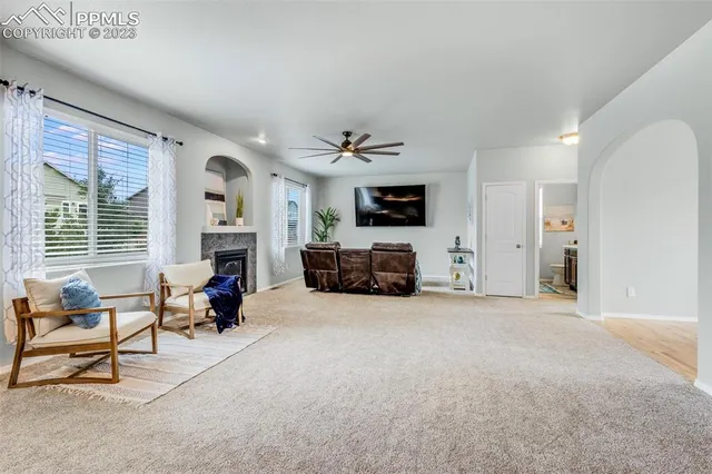 a view of a livingroom with furniture and a flat screen tv