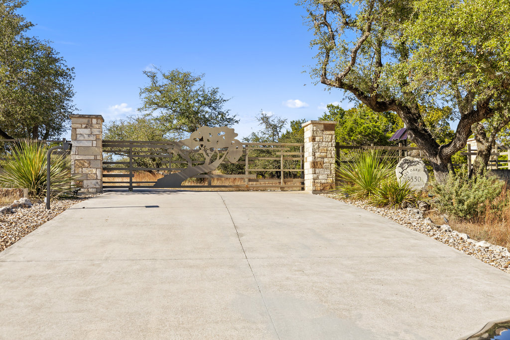 3550 Bell Springs Road Dripping Springs, TX 78620 - Photo 2 of 40 a view of a yard with plants and trees