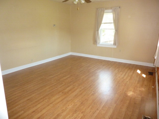 7362 Port Republic Road Port Republic, VA 24471 - Photo 3 of 15 an empty room with wooden floor and windows