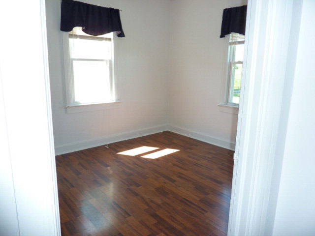 7362 Port Republic Road Port Republic, VA 24471 - Photo 4 of 15 a view of an empty room with wooden floor and a window