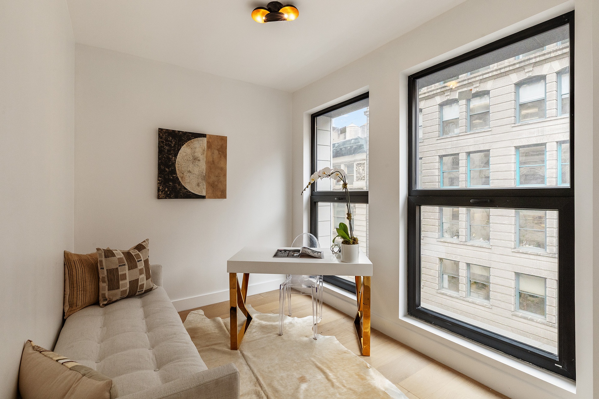 21 West 17th Street, Unit 5 Manhattan, NY 10011 - Photo 7 of 18 a living room with furniture and a window