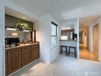a view of a kitchen from the living room