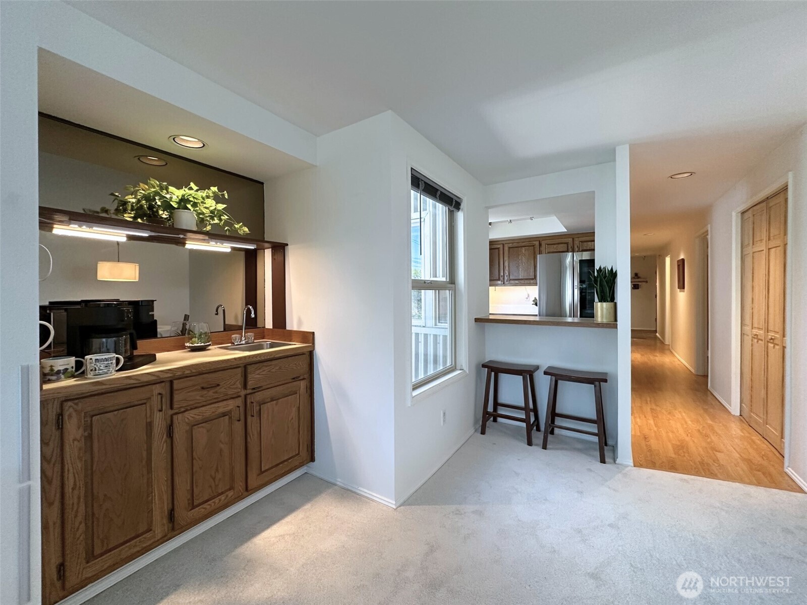 3204 Alki Avenue Southwest, Unit 1 Seattle, WA 98116 - Photo 11 of 35 a view of a kitchen from the living room