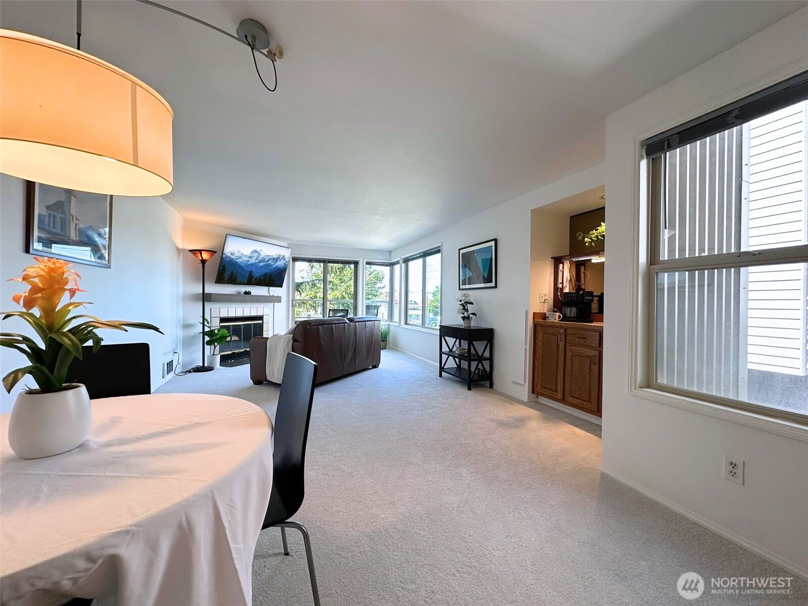 3204 Alki Avenue Southwest, Unit 1 Seattle, WA 98116 - Photo 12 of 35 a room with furniture and a flat screen tv