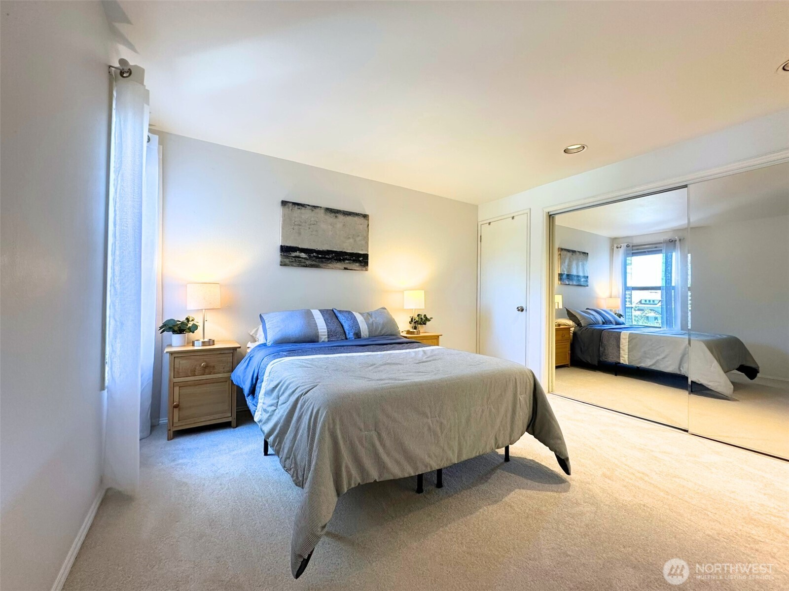 3204 Alki Avenue Southwest, Unit 1 Seattle, WA 98116 - Photo 17 of 35 a spacious bedroom with a bed and a couch