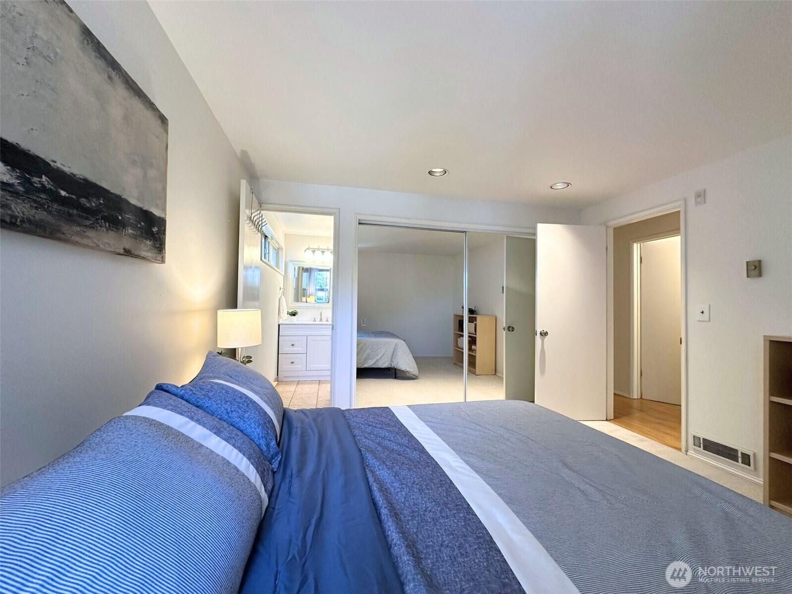 3204 Alki Avenue Southwest, Unit 1 Seattle, WA 98116 - Photo 19 of 35 a bedroom with a bed and wooden floor