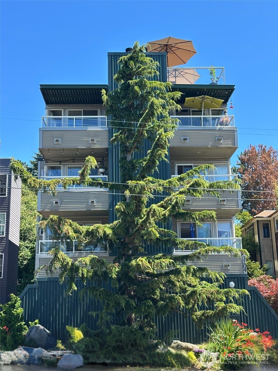 3204 Alki Avenue Southwest, Unit 1 Seattle, WA 98116 - Photo 35 of 35 a front view of a house with a yard