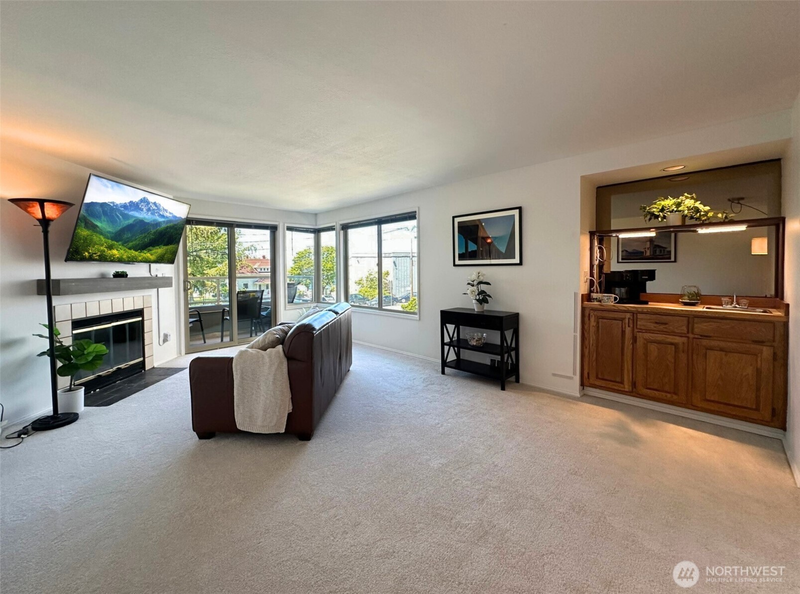 3204 Alki Avenue Southwest, Unit 1 Seattle, WA 98116 - Photo 8 of 35 a living room with furniture and a fireplace