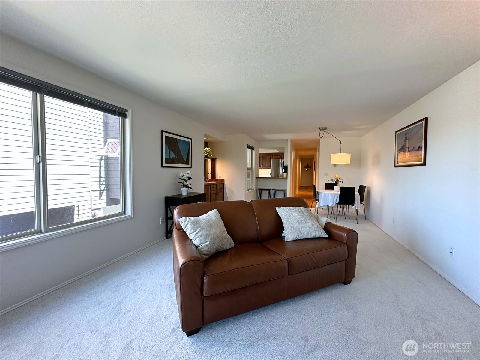 3204 Alki Avenue Southwest, Unit 1 Seattle, WA 98116 - Photo 9 of 35 a living room with furniture and a window