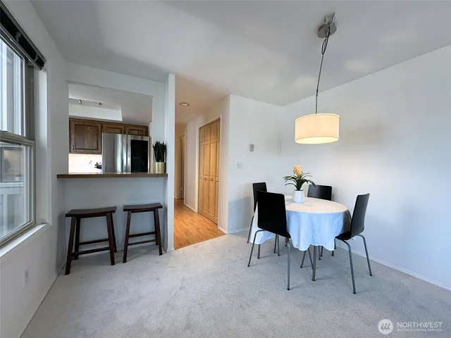 a view of a dining room with furniture