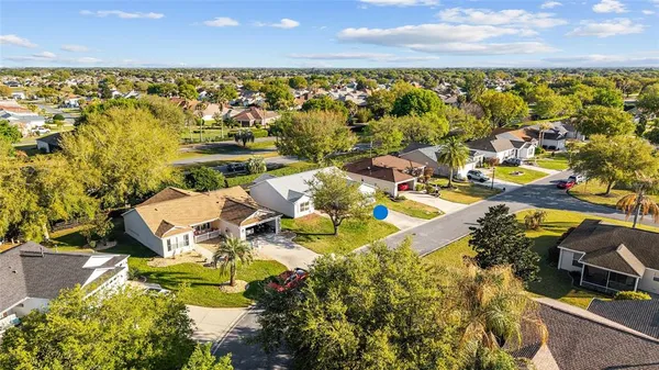 an aerial view of a house with a swimming pool