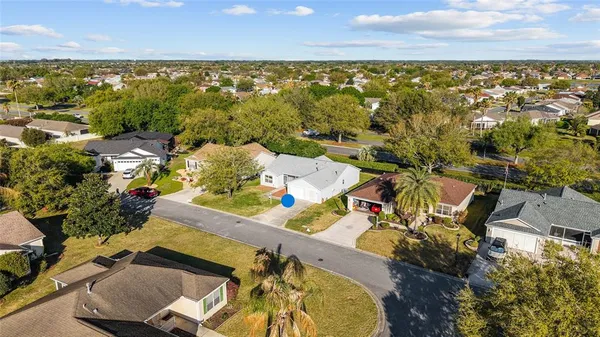an aerial view of a house with a swimming pool