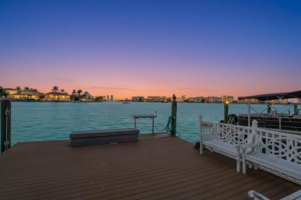 8911 Blind Pass Road, Unit 118 St. Pete Beach, FL 33706 - Photo 7 of 34 a view of a terrace with outdoor seating