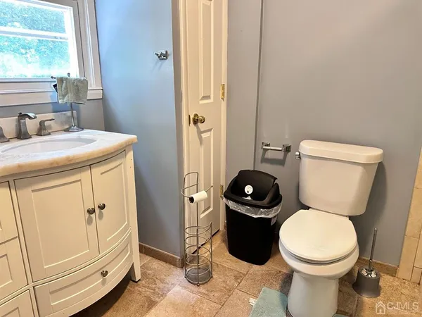 a bathroom with a toilet and a sink