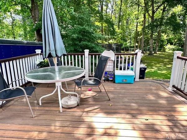 a backyard of a house with table and chairs