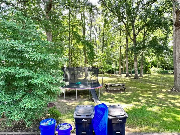 a view of an chairs and table in the patio
