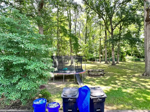 a view of an chairs and table in the patio